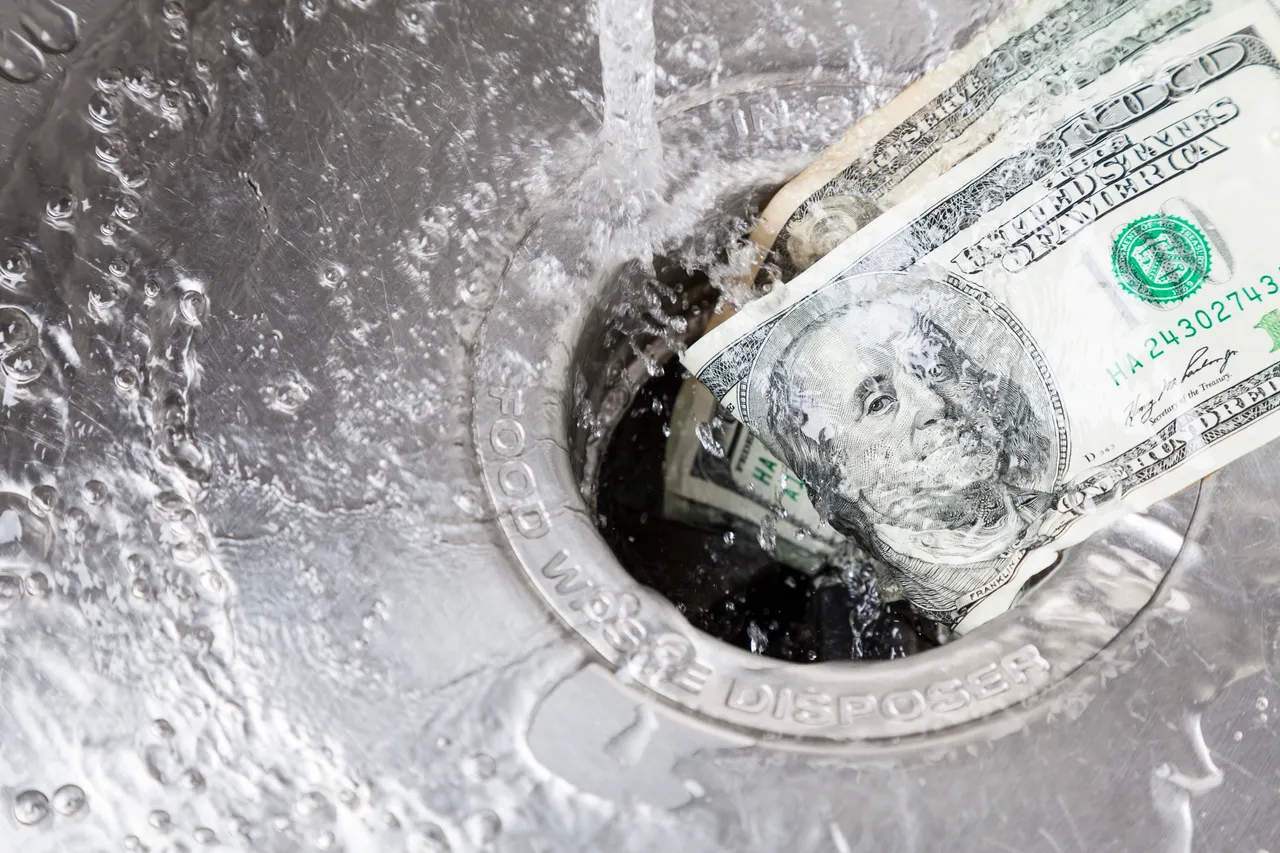 Cash being washed away in sink